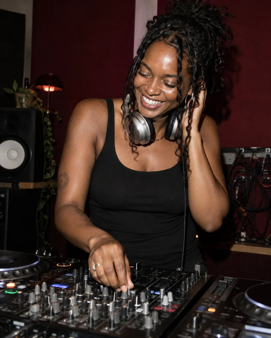 A music campaign portrait of a DJ at the mixing desk